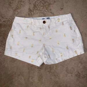White and gold pineapple shorts.